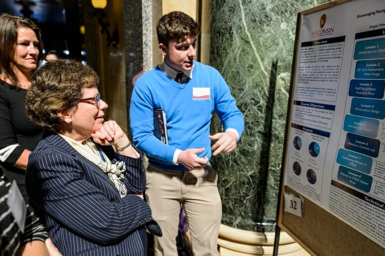 UW-Madison Chancellor Rebecca Blank asks questions of student Tyler Klink about he and his teammates' research project.