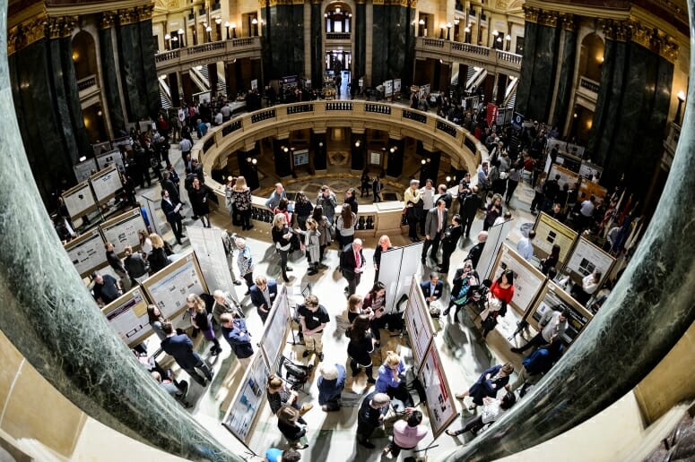 UW-Madison students present their research project displays as people fill the Wisconsin State Capitol during Research in the Rotunda.