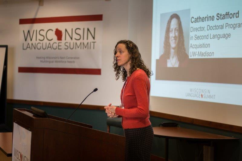 Woman speaks from behind a podium