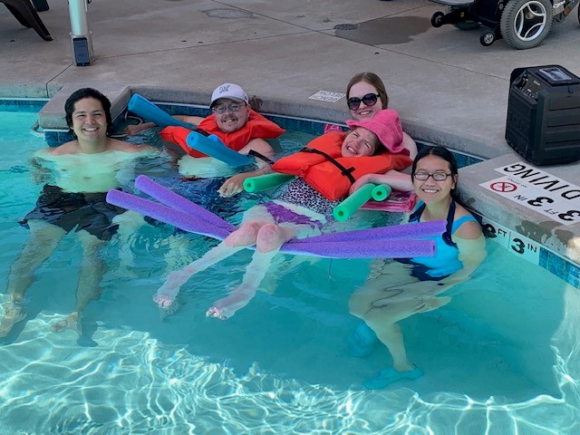 kids and woman in pool