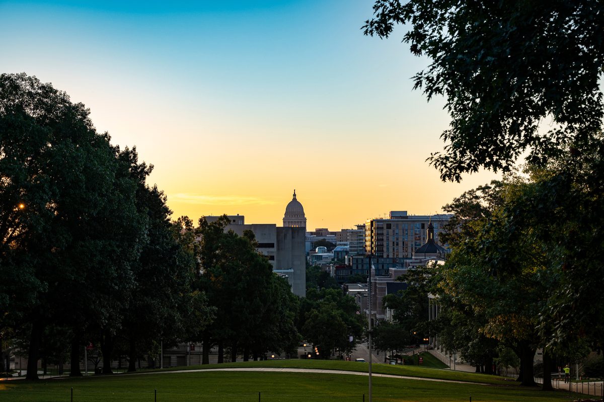State Capitol in the distance at sunrise from Bascom Hill.