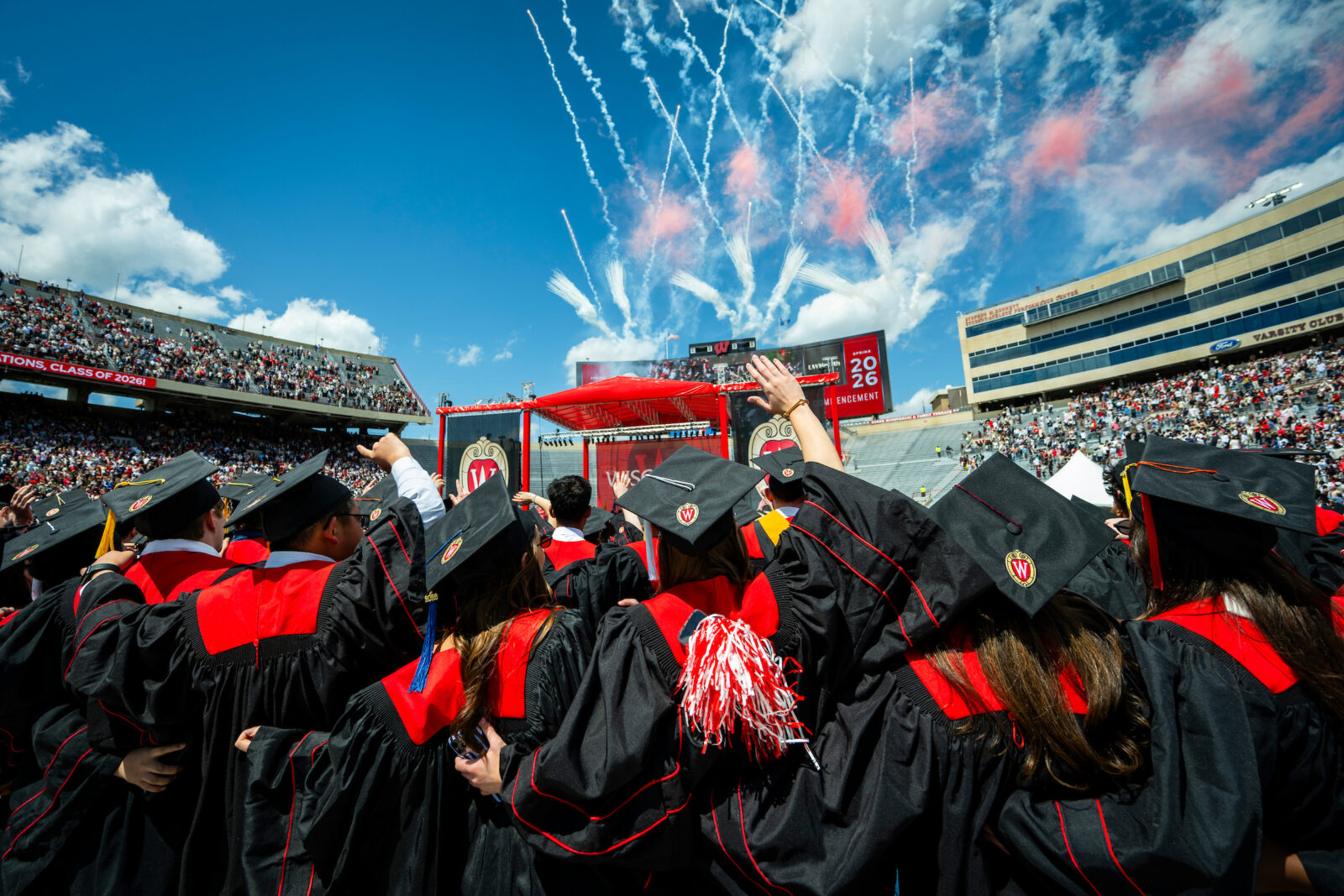 Fireworks go off as graduates sing “Varsity” during the UW–Madison's spring commencement ceremony at Camp Randall Stadium at the University of Wisconsin–Madison on May 9, 2026. The outdoor graduation was attended by thousands of bachelor’s, master’s and law degree candidates, plus their guests. at the University of Wisconsin–Madison on May 9, 2026.
